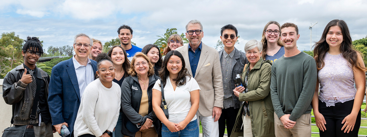 Chancellor and Mrs. Assanis with President Milliken and students.